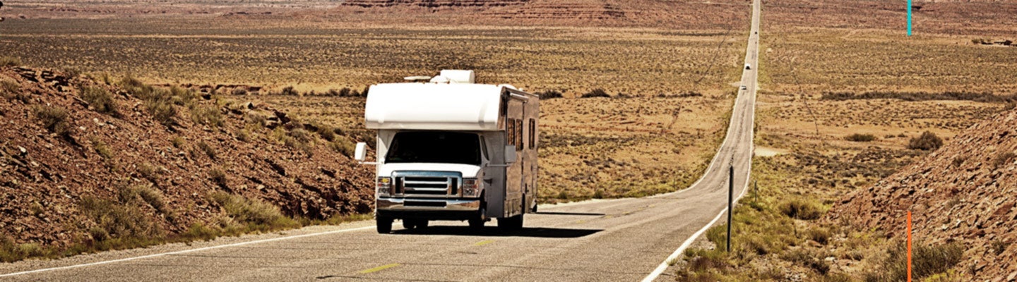 RV driving down long highway