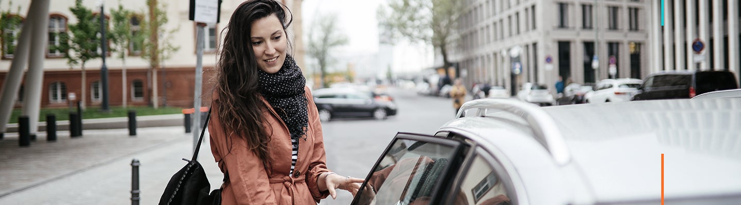 Woman getting into a car