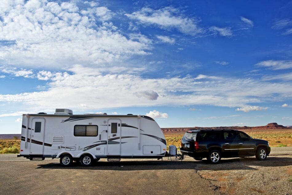 Is my travel trailer automatically covered when I’m pulling it with my truck?