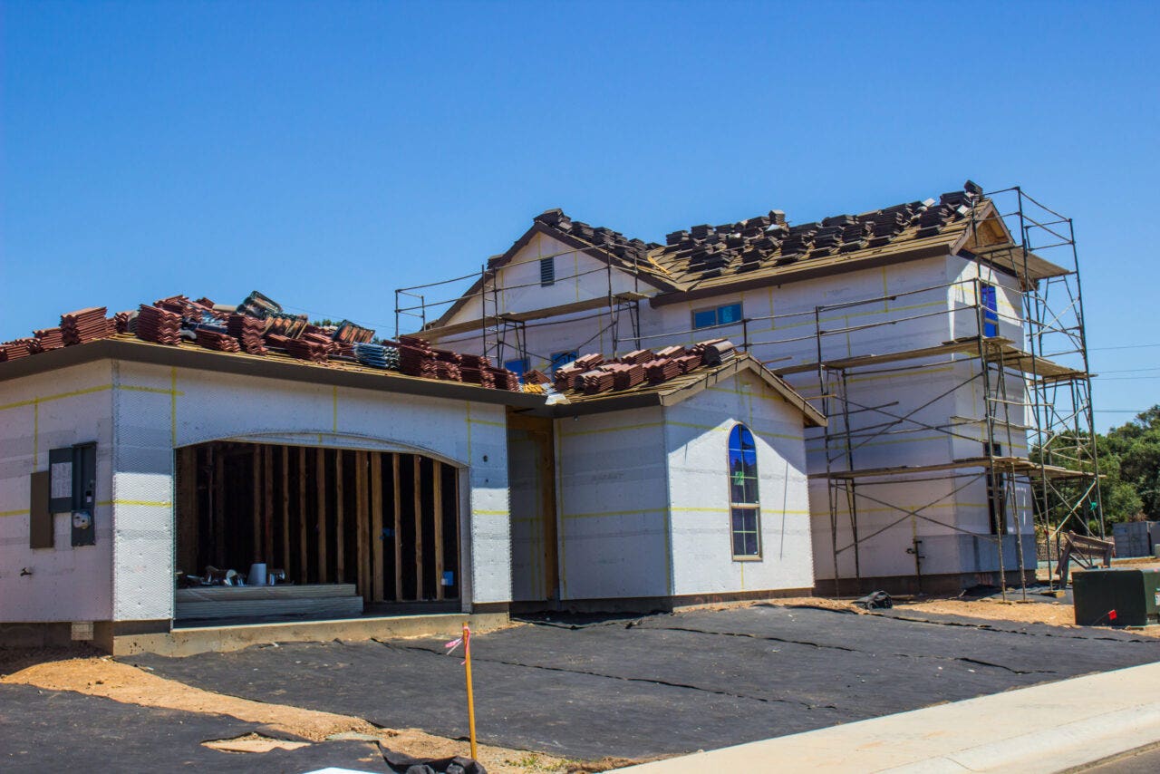 Installing a new roof on a home.