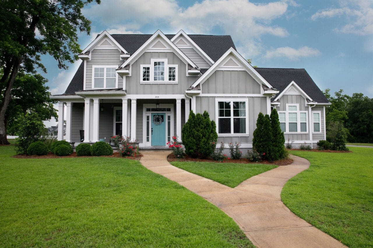 Large home with attractive metal siding.