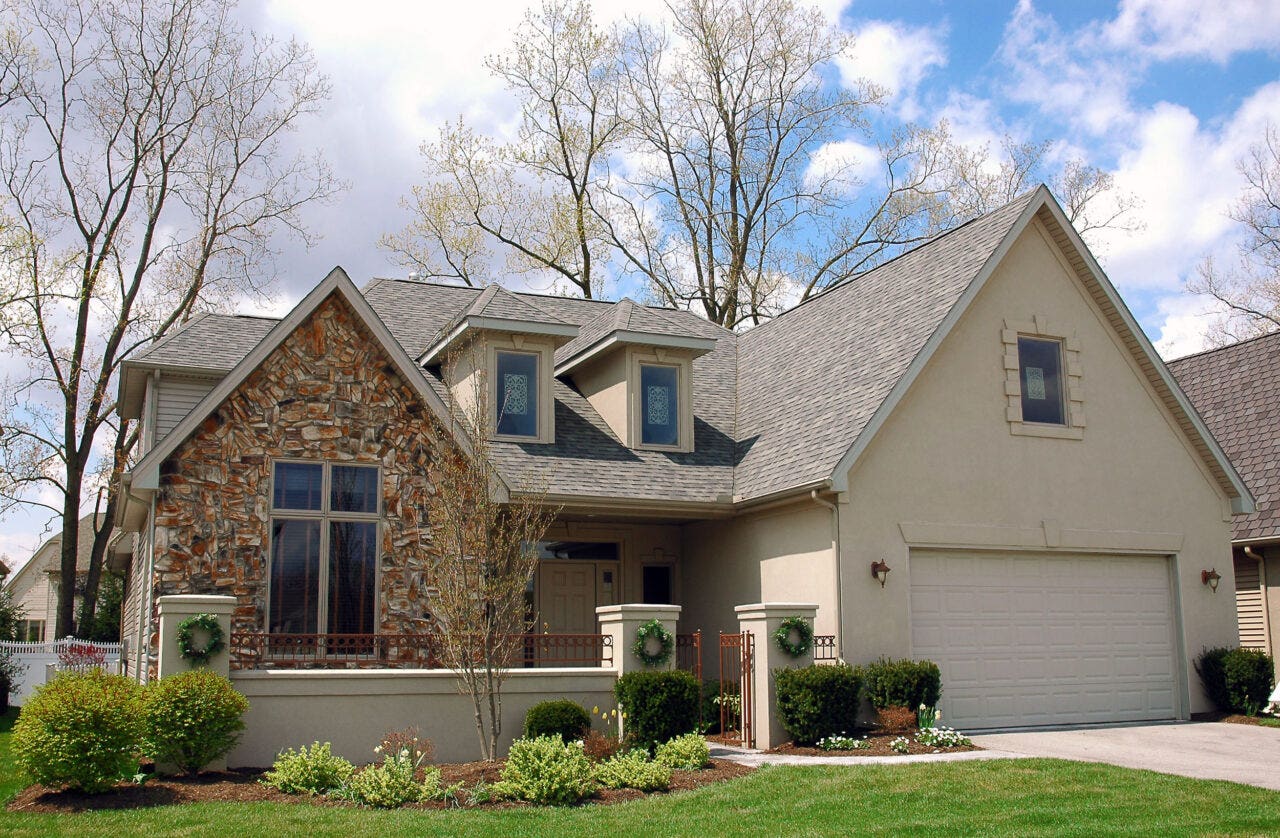 Stucco and stone home.