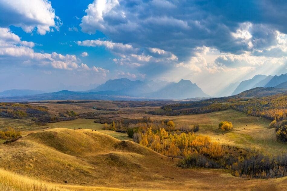 Alberta's prairie, foothills and mountains as a weather system rolls in.