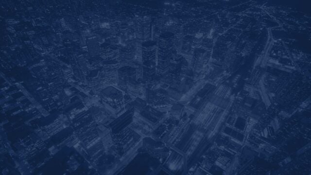 Aerial view of Toronto city at night with a navy blue image overlay