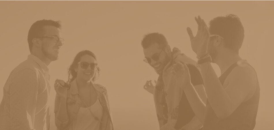 A group of friends dancing outdoors