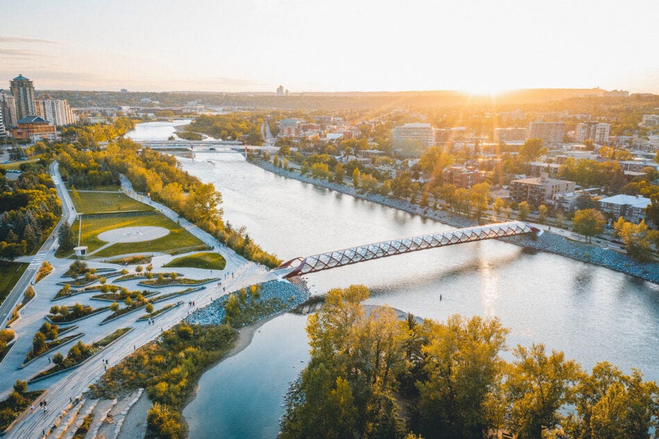 Picture of a bridge over a river at sunset in east downtown Calgary.