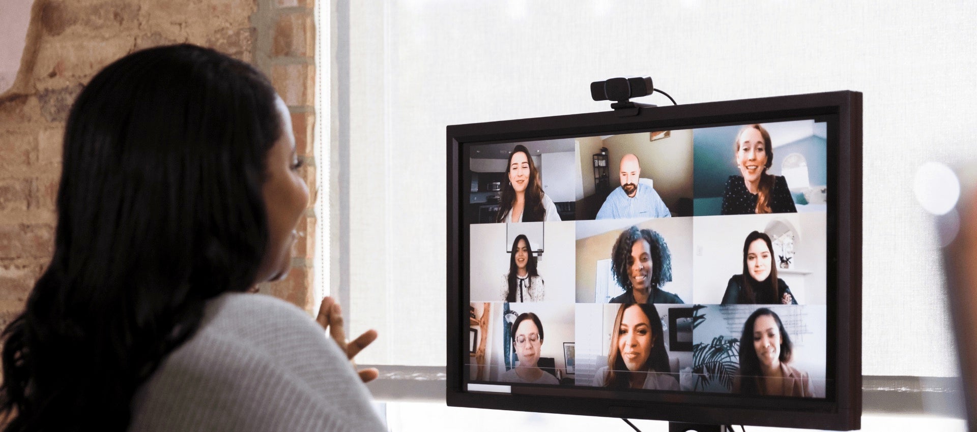 Employee on video call with team