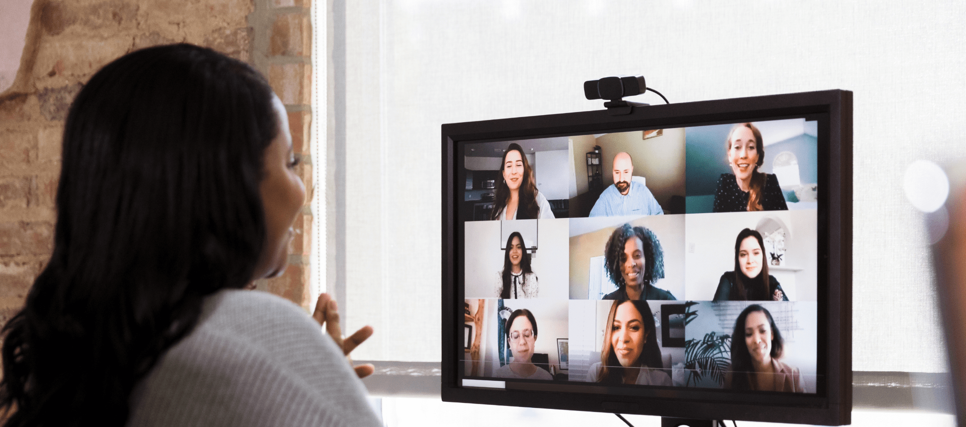 Employee on video call with team