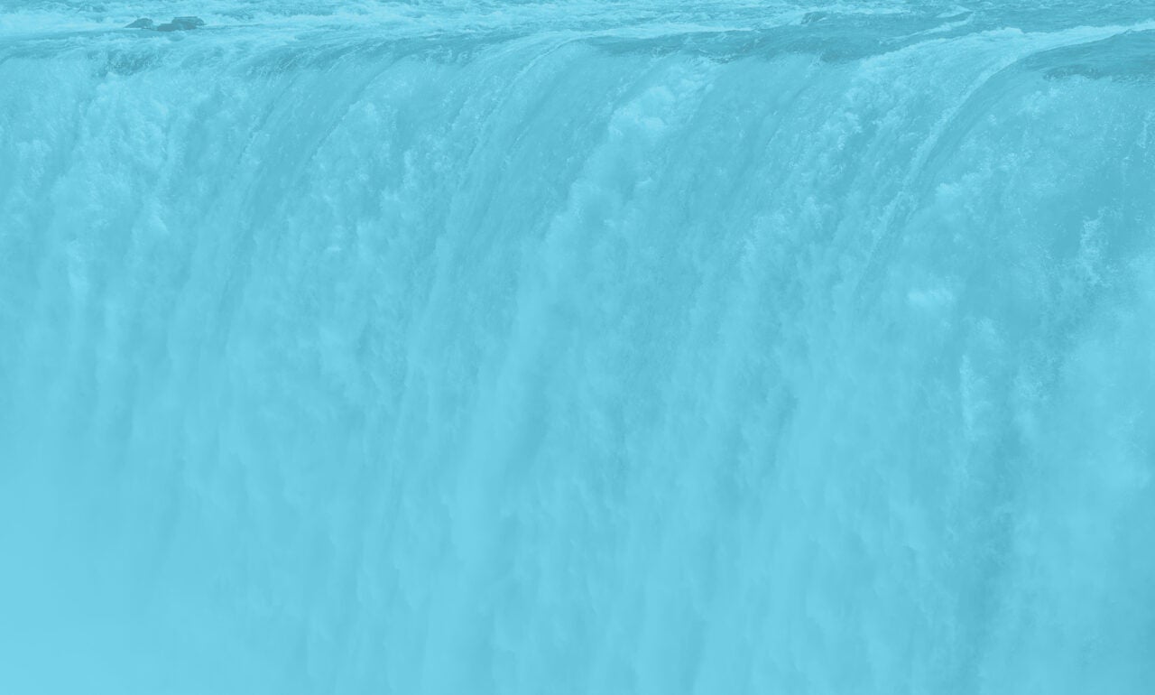 a waterfall with a sky blue image overlay