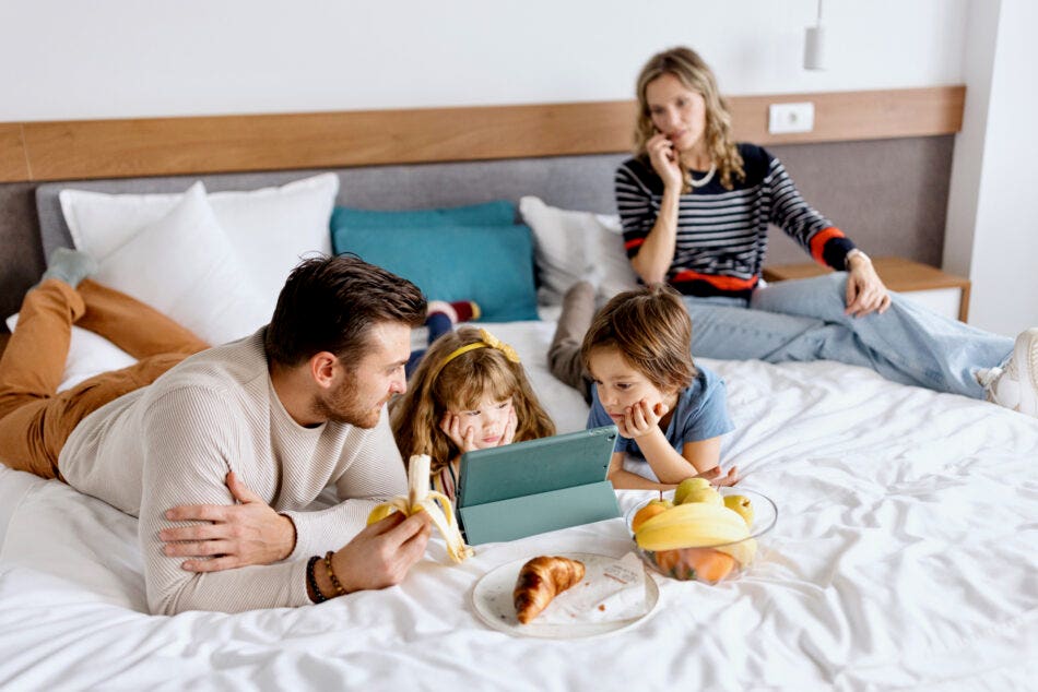 Family in hotel room after evacuation