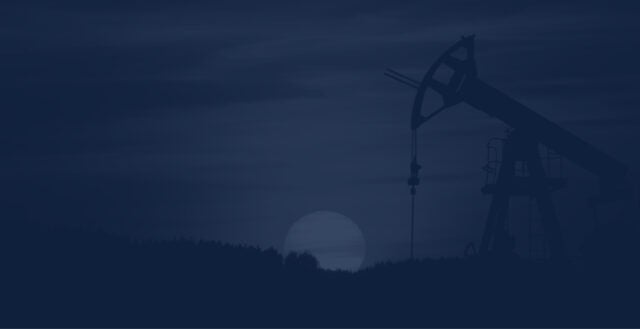 an oil and gas work site with the sun setting in the background, with a dark blue overlay