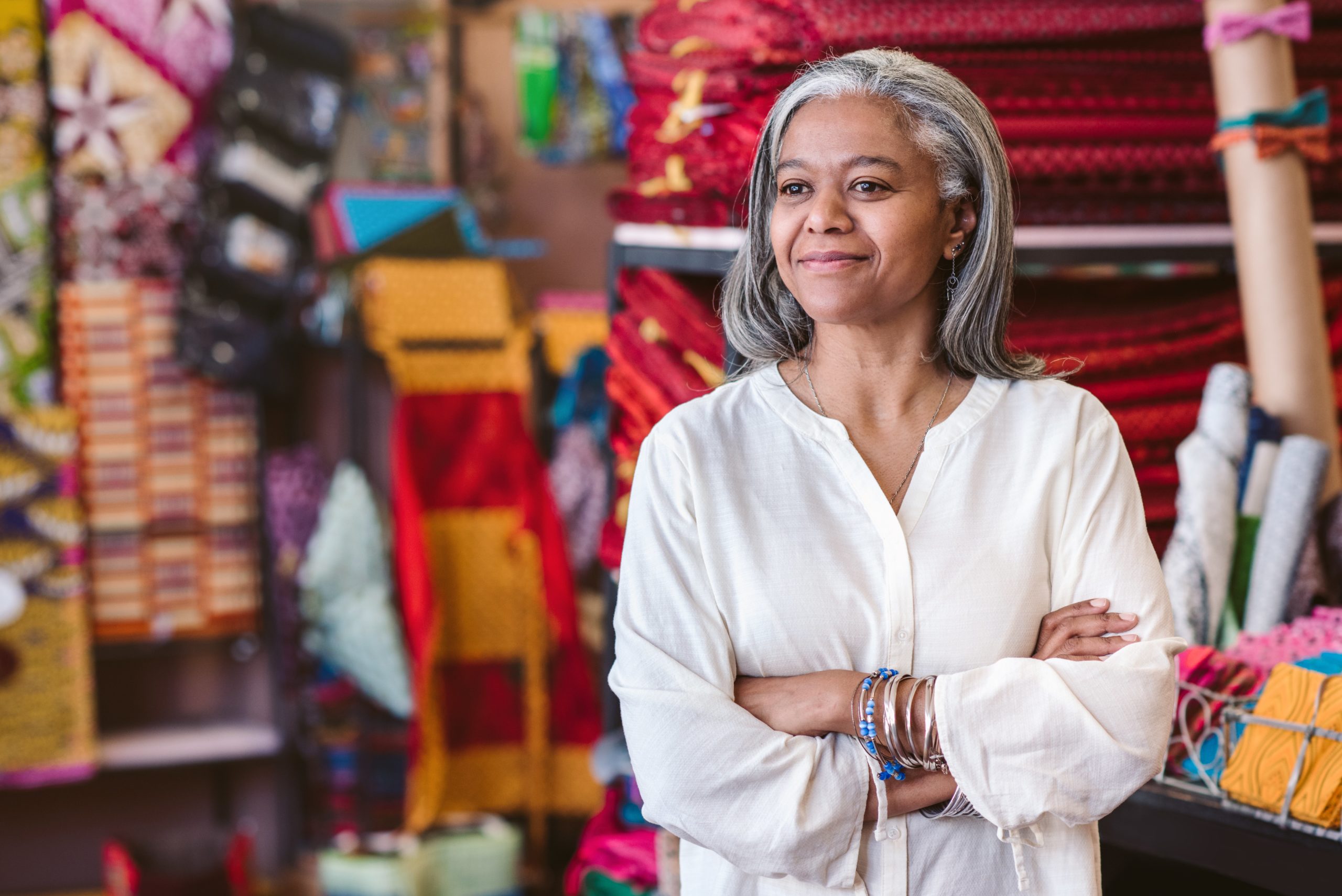 Woman in her small business smiling