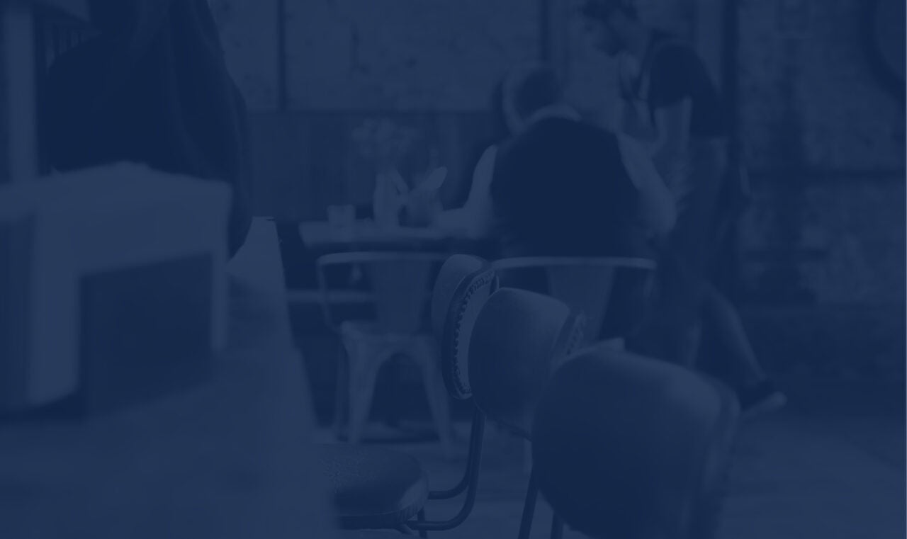 View of barstools in a busy restaurant