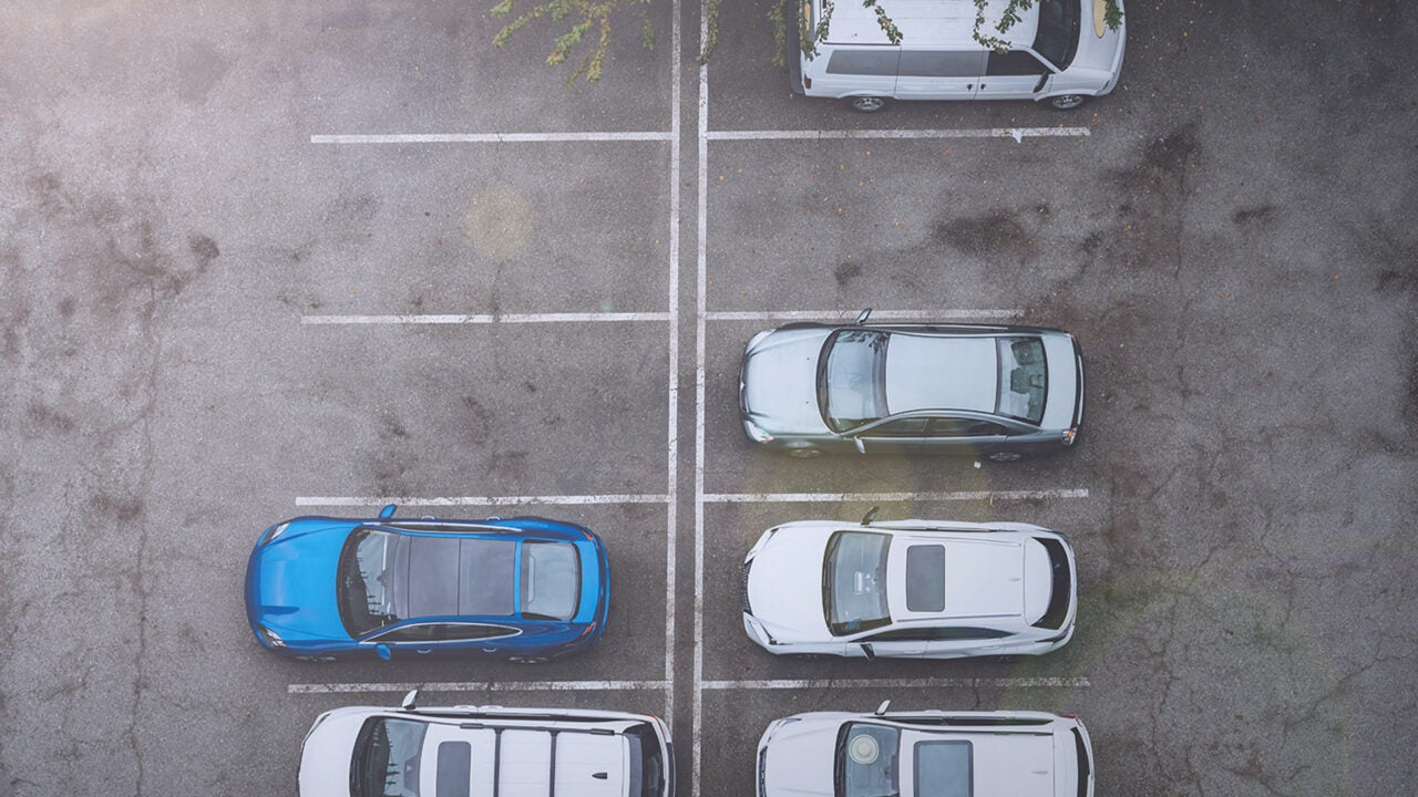 Who is at fault for a collision in a parking lot?