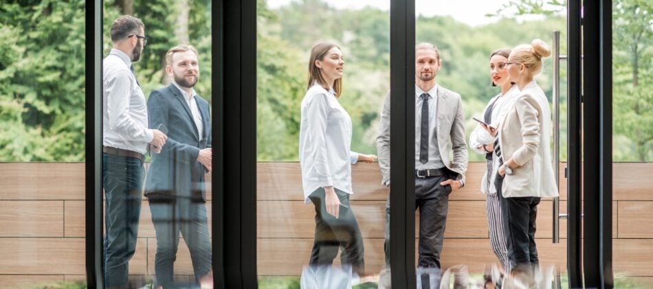 Group of business professional on a patio talking