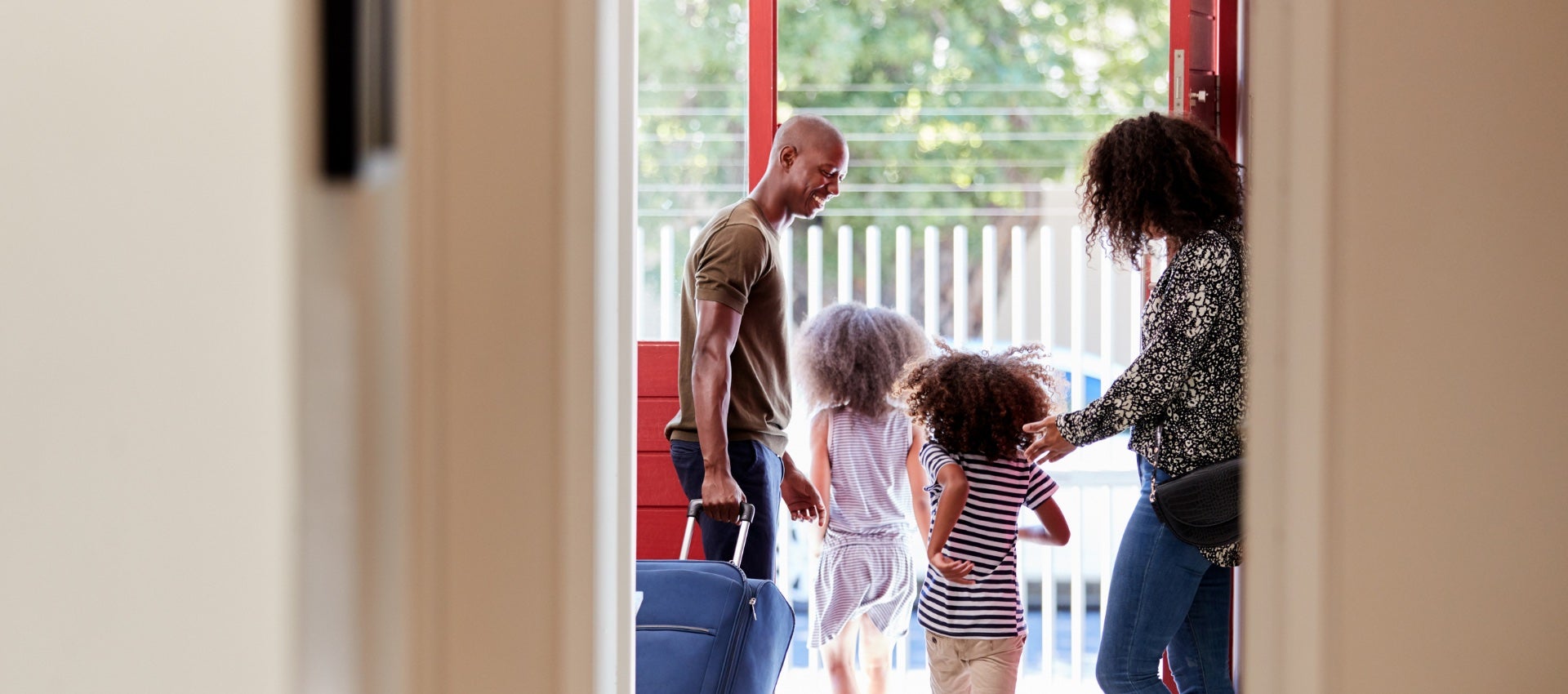 Young family at the front door of a vacant home