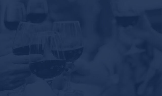 multiple wine glasses cheering together a winery