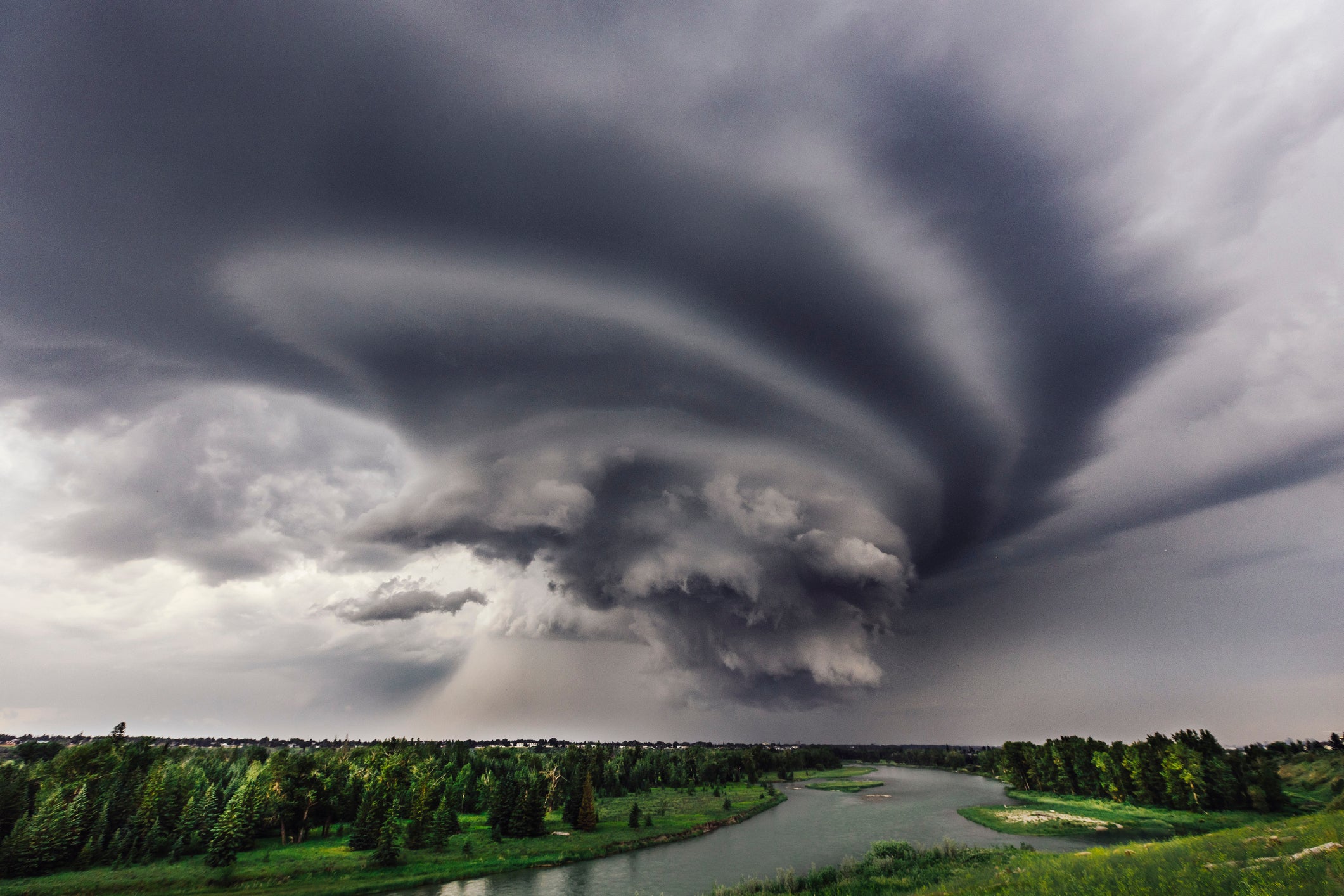Large storm over river and trees