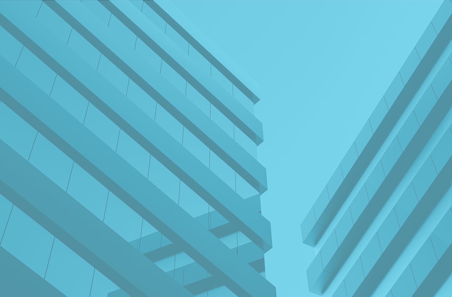 View from below of tall buildings with sky in the background